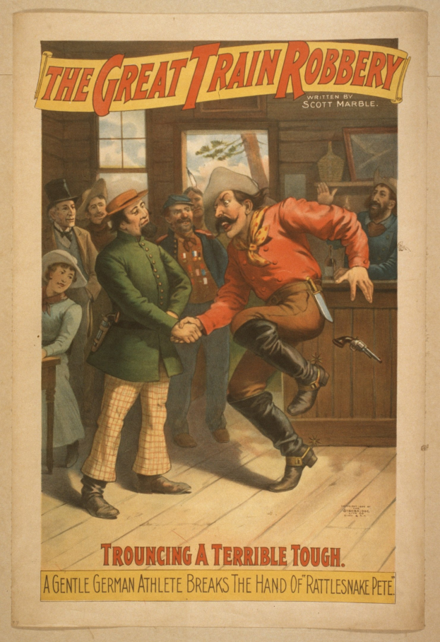 Plakat, das eine Gruppe von Menschen auf einem Boden mit einem, der eine Waffe hält, einem Fenster und einer Wand im Hintergrund und dem Text "The Great Train Robbery - Trouching a Terrible Tough" oben und unten zeigt.