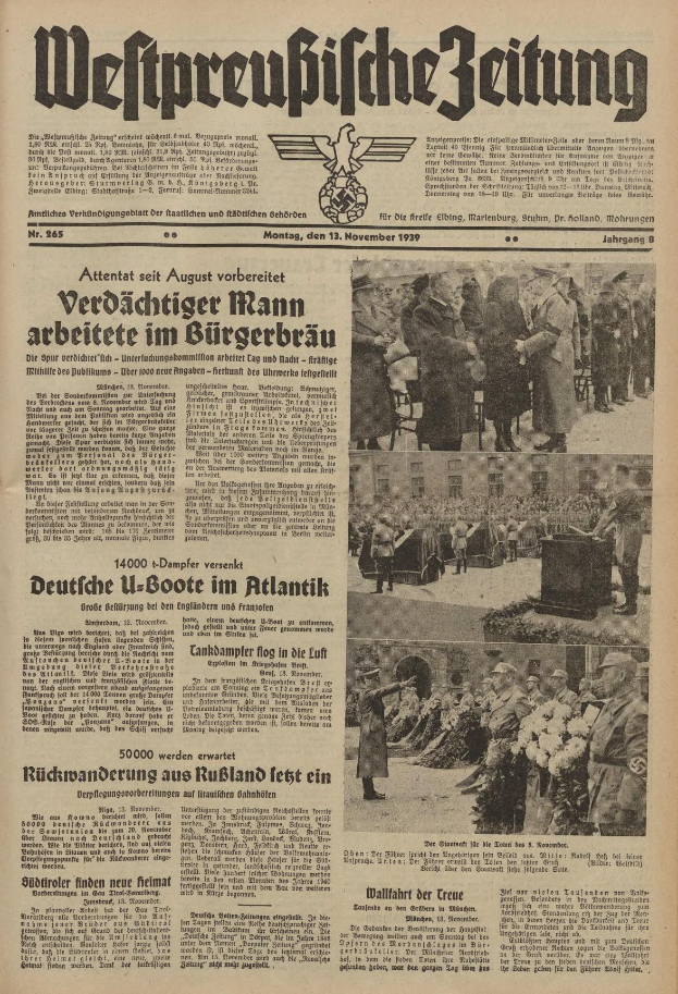 Schwarze und weiße Titelseite einer deutschen Zeitung vom 13. November 1939 mit der Überschrift "Weitpreubliche Zeitung" und einer Gruppe von Menschen in traditioneller deutscher Kleidung beim Feiern.